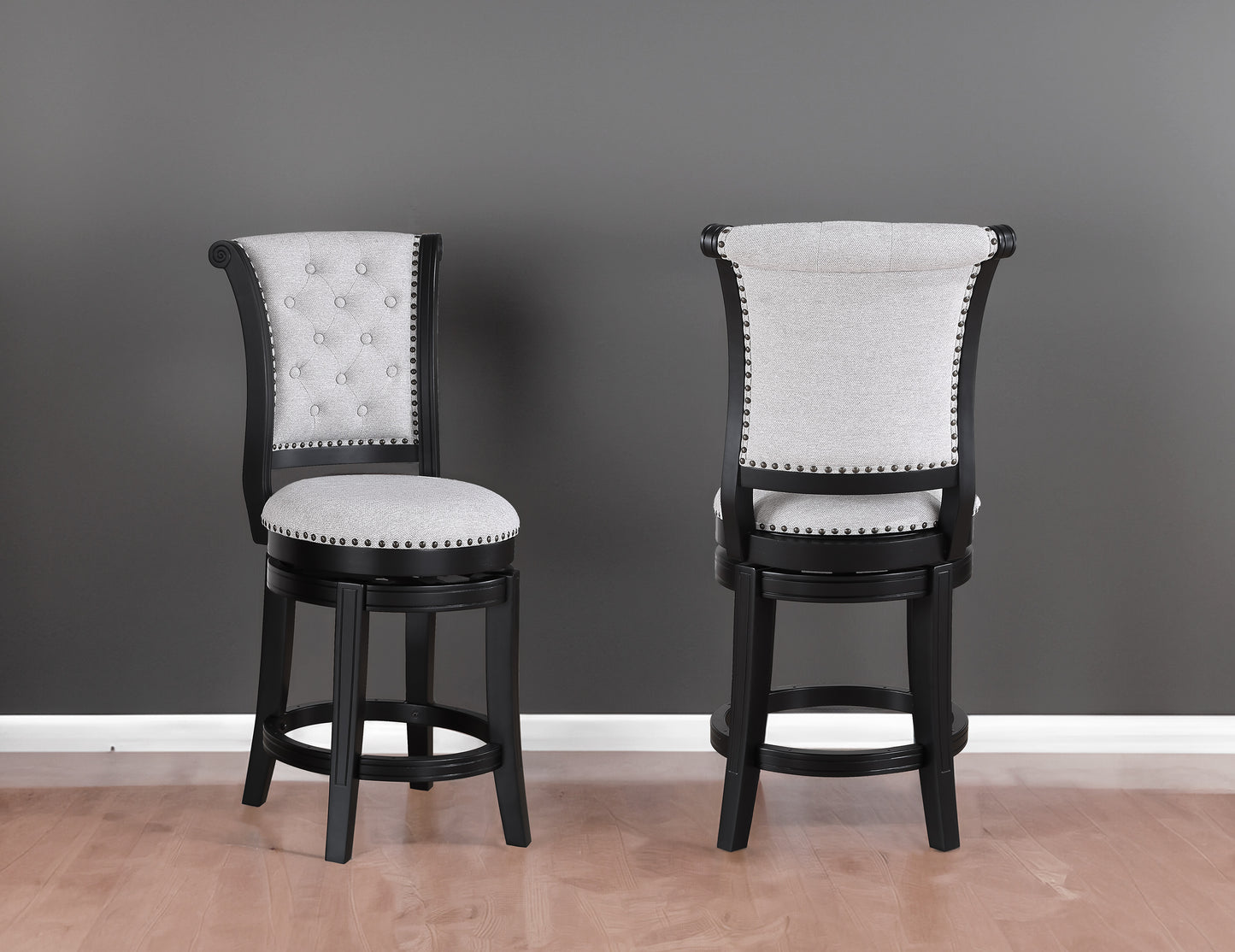 Elegant grey upholstered bar stool with nailhead trim and dark wood frame