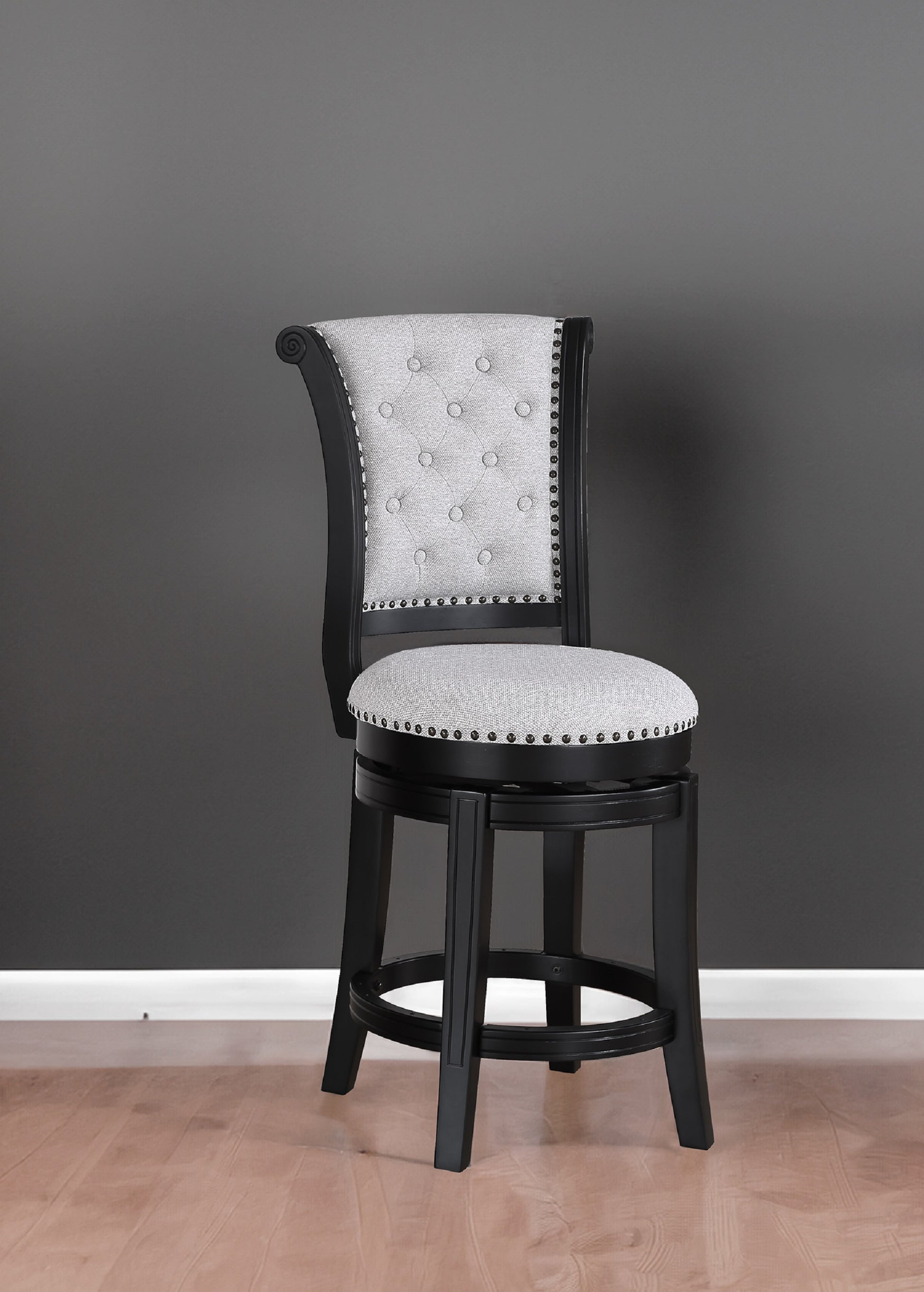 Black wooden swivel bar stool with light gray tufted fabric seat and back
