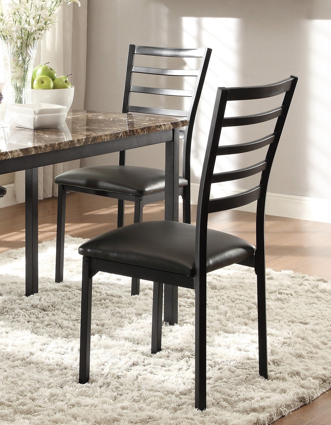 Modern black metal dining chair with horizontal ladder back and faux leather seat