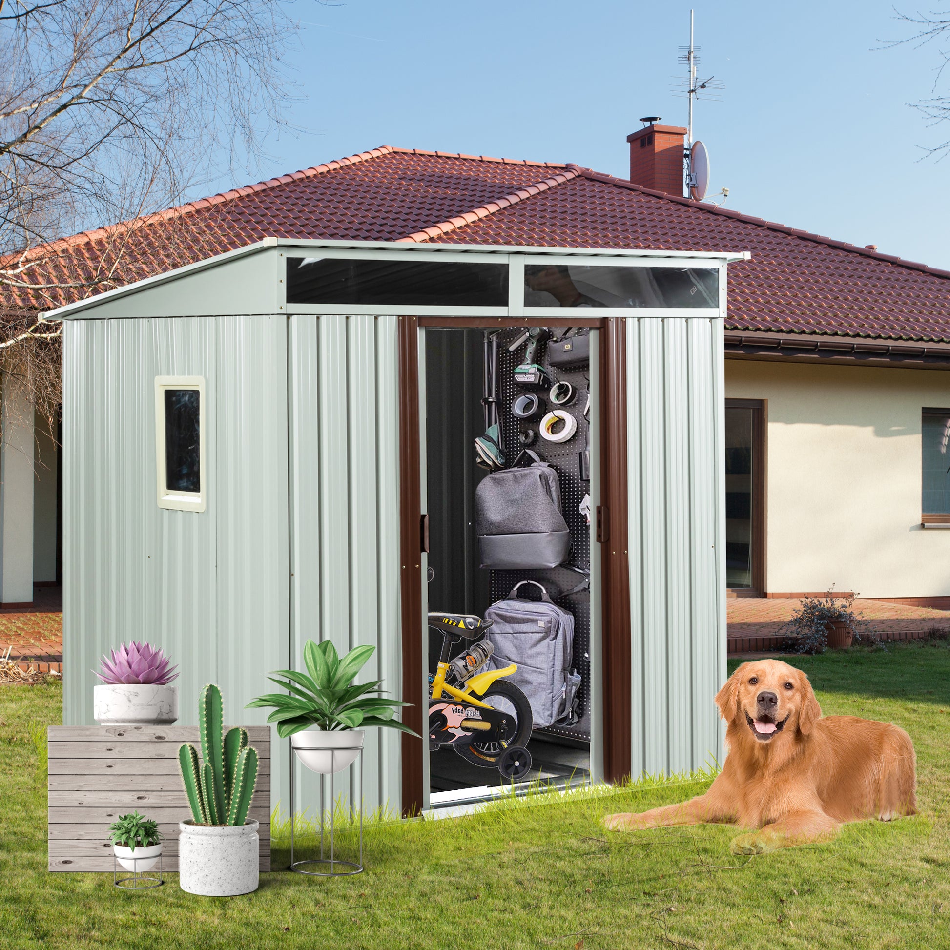 Sage green metal garden shed with double doors open showcasing storage organization