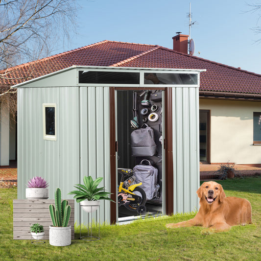 Sage green metal garden shed with double doors open showcasing storage organization