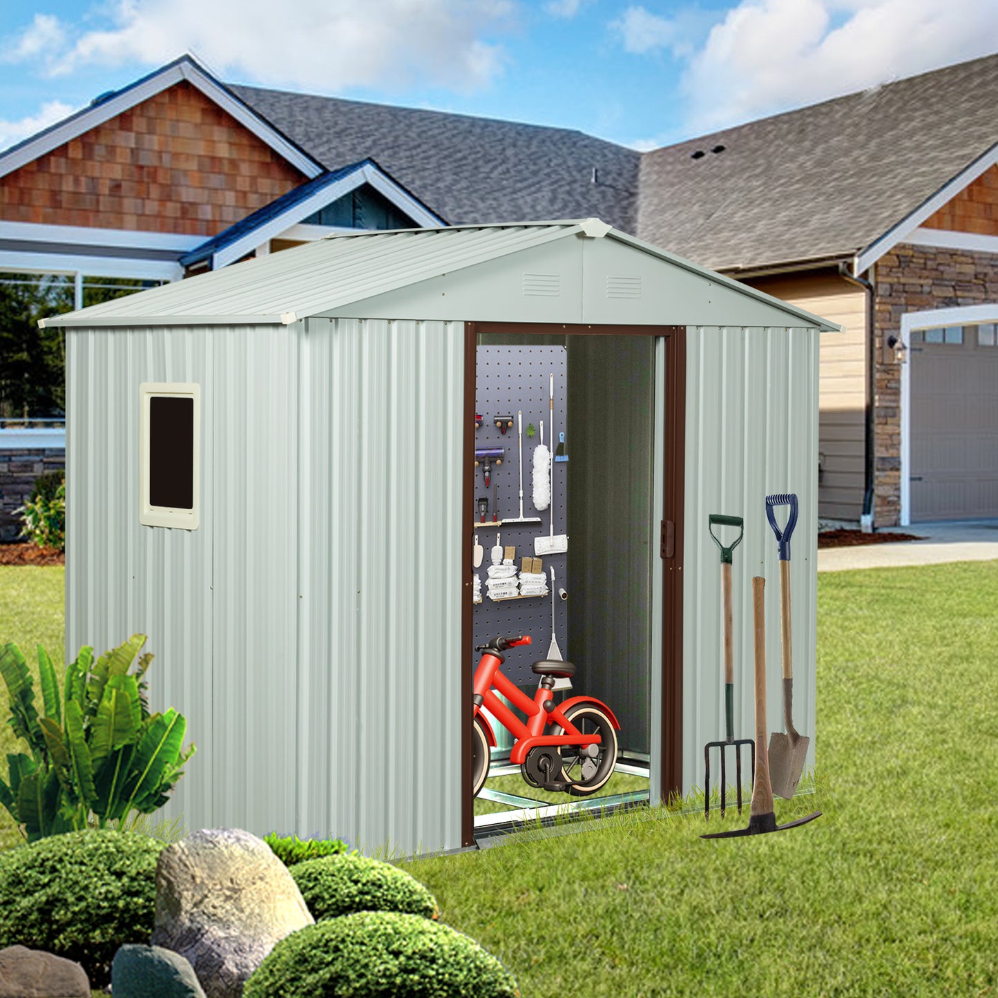 Silver metal garden shed with tool storage and red childs bicycle inside