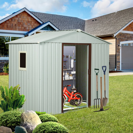 Silver metal garden shed with tool storage and red childs bicycle inside