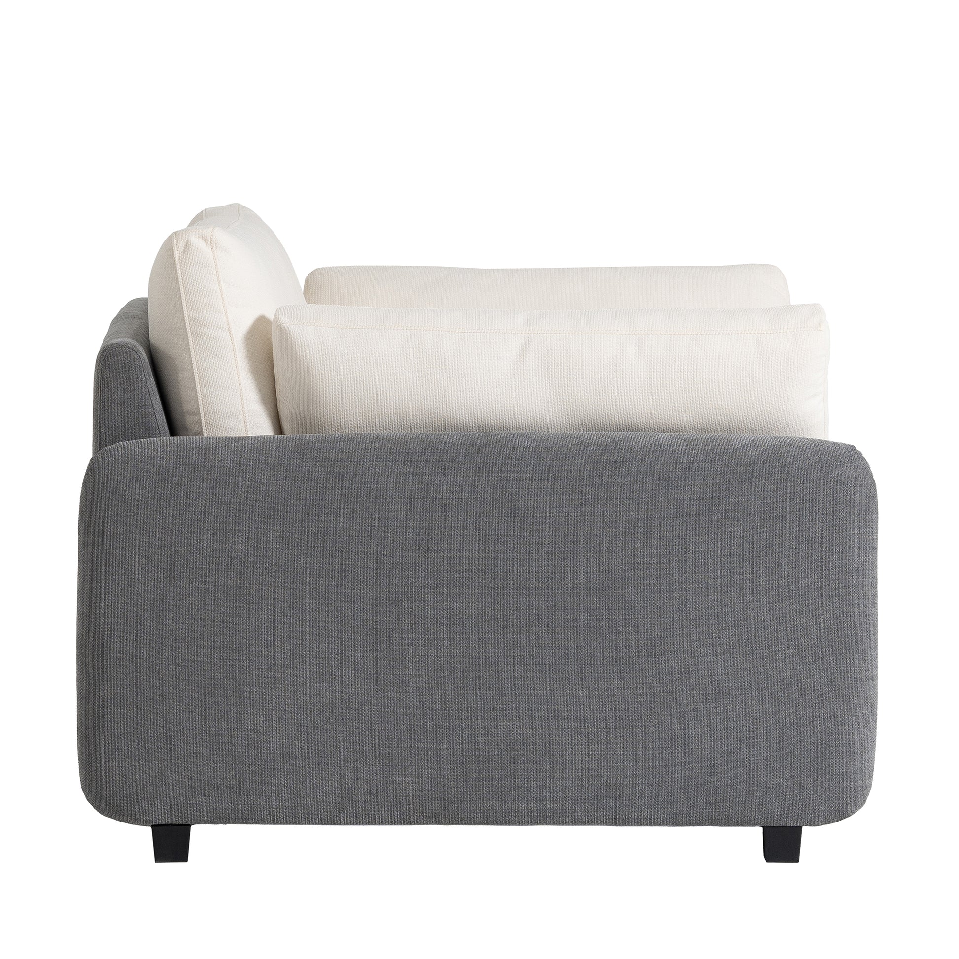 Modern grey sofa with plush white accent pillows perfect for living room relaxation
