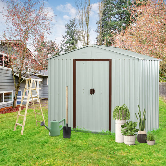 Pale green corrugated metal storage shed with brown trim doors