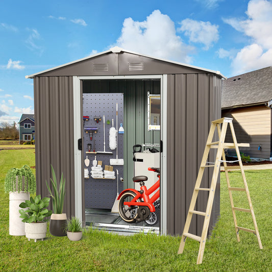 Grey metal storage shed with tools and red bicycle inside