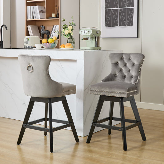 Grey velvet bar stool with tufted back and silver nailhead trim perfect for kitchen island seating