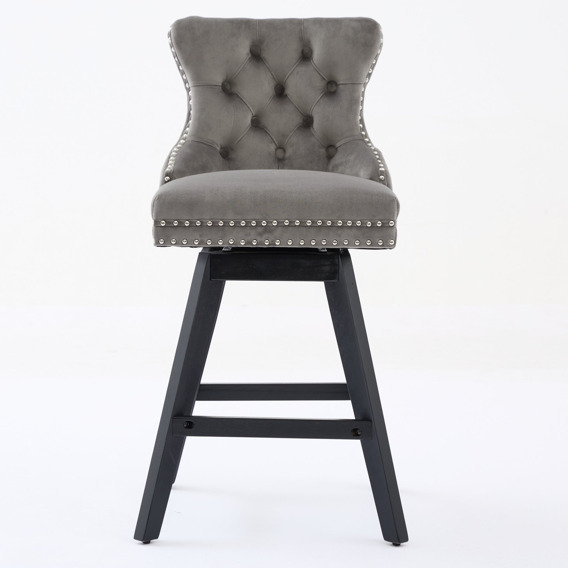 Tufted grey velvet bar stool with silver nailhead trim and black wooden legs