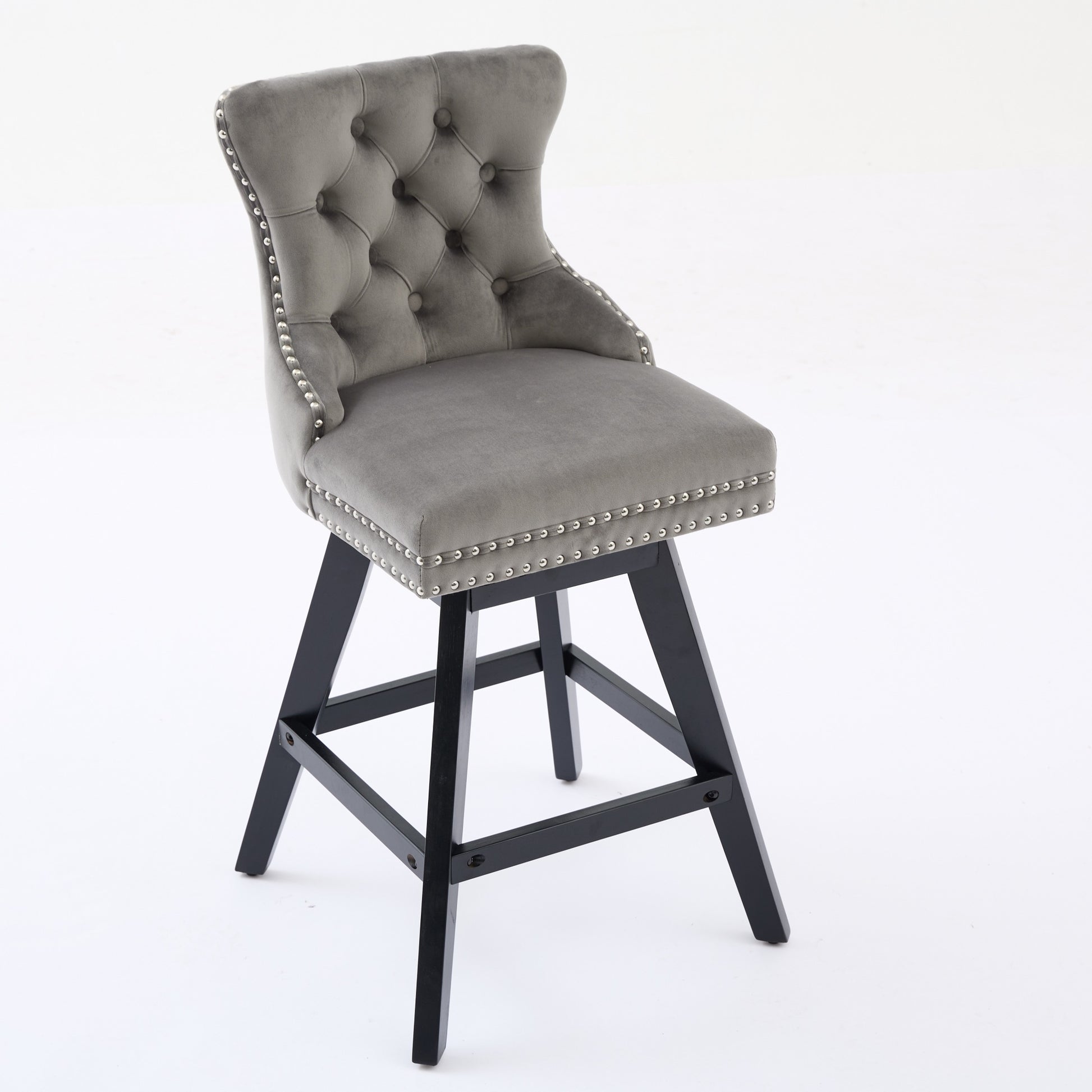 Grey velvet bar stool with tufted back and silver nailhead trim