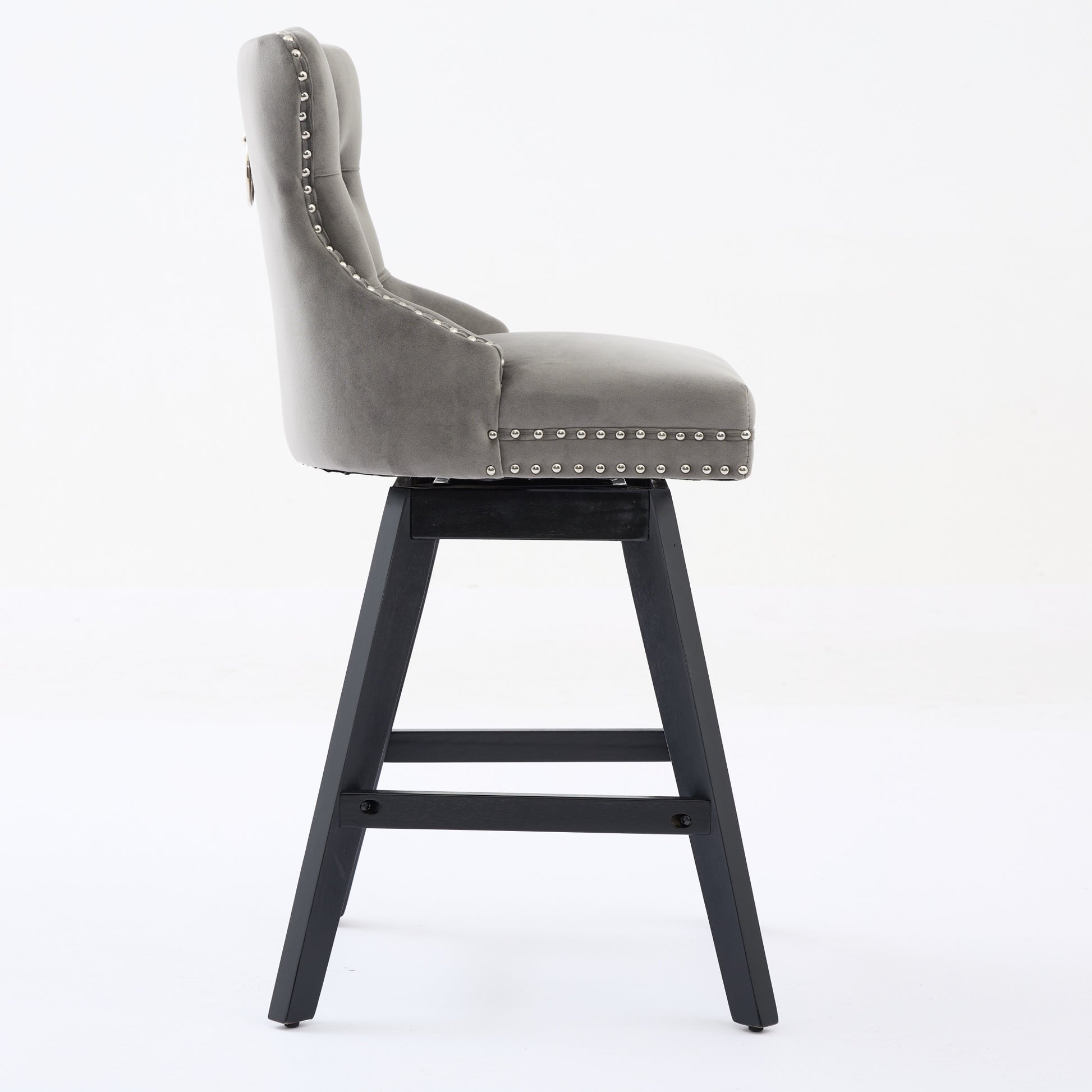 Grey velvet swivel bar stool with tufted back and silver nailhead trim