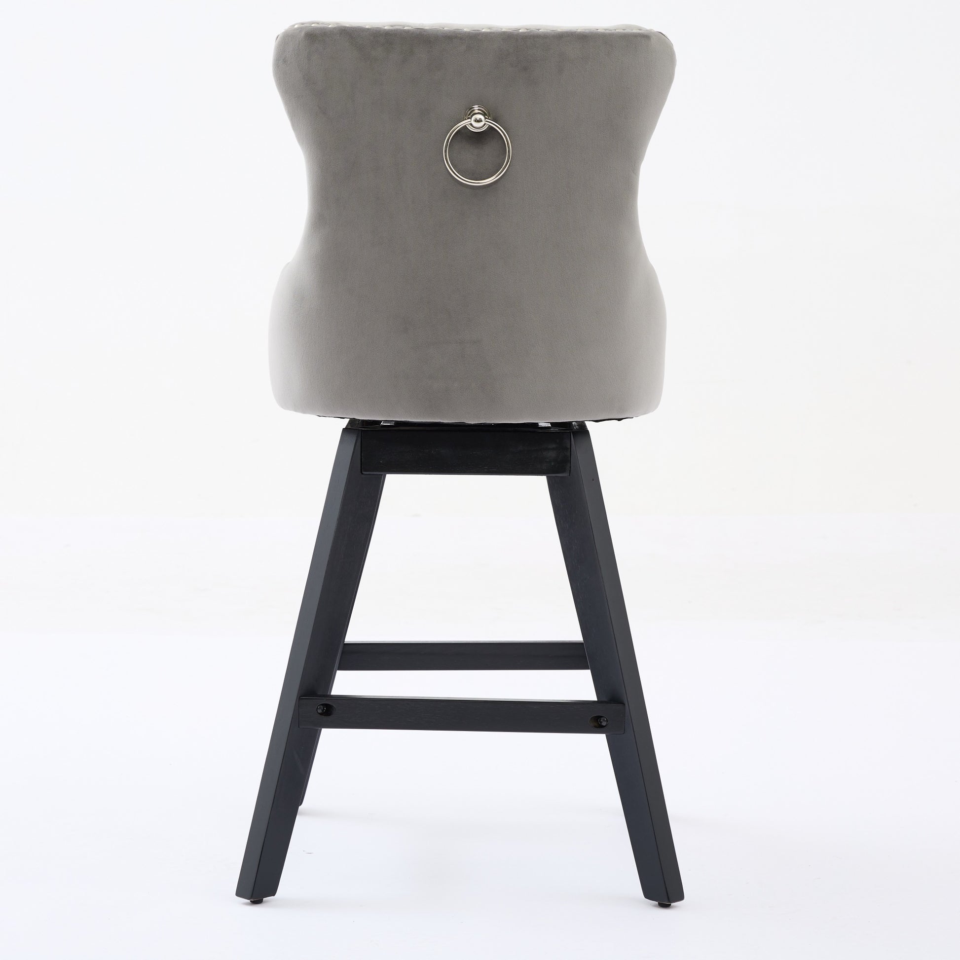 Gray velvet bar stool with chrome ring detail and dark wood legs