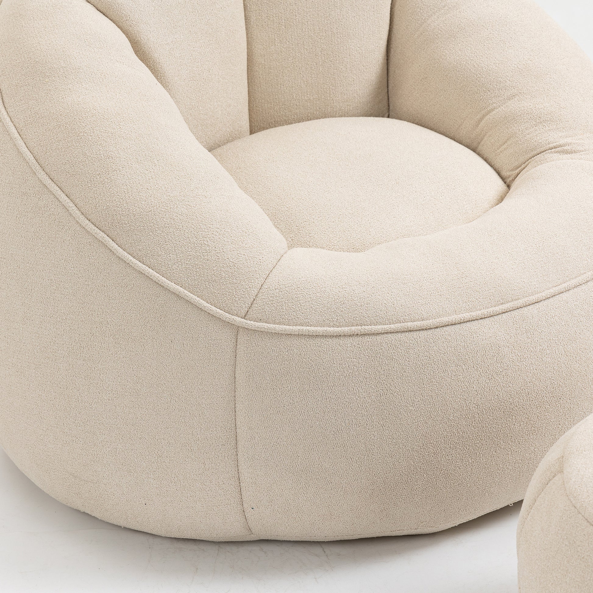 Plush ivory boucl accent chair with rounded tufted cushions for modern comfort