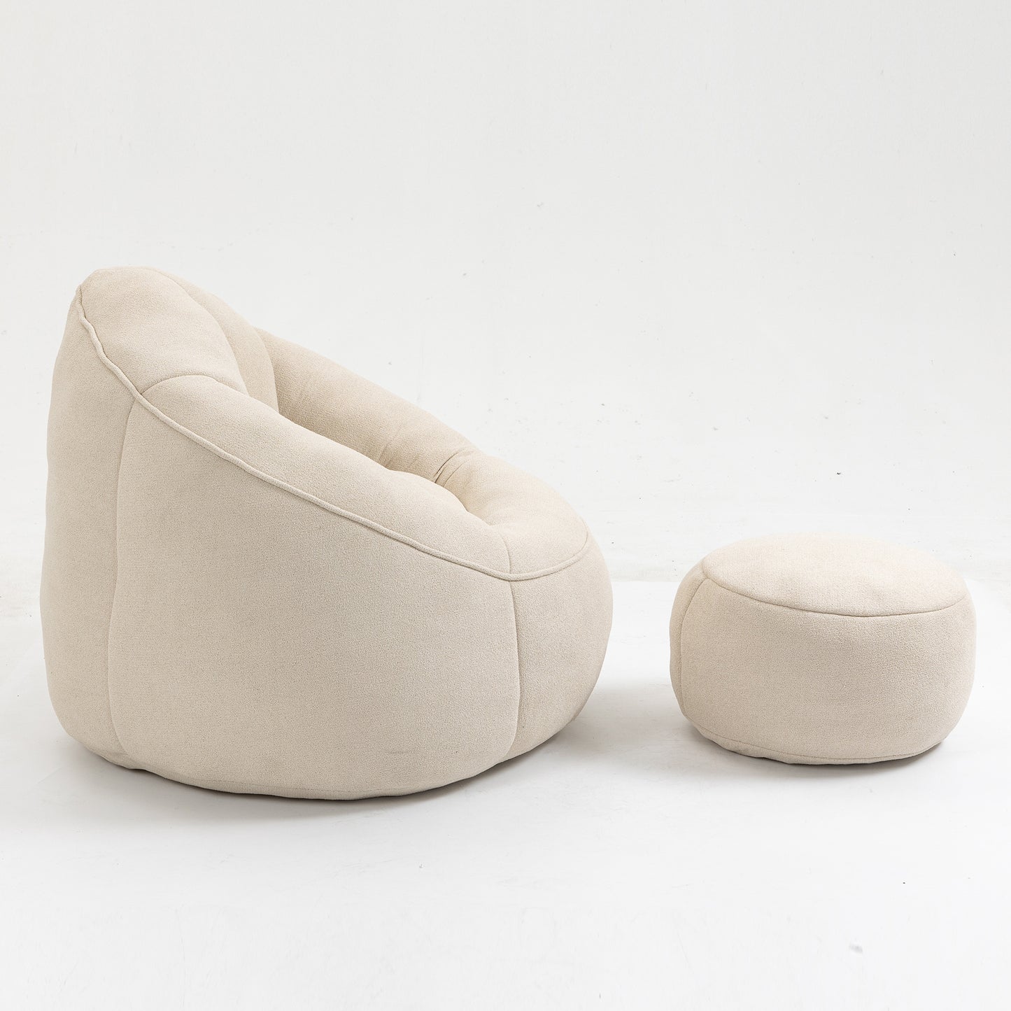 Light beige textured fabric bean bag chair and matching ottoman for cozy relaxation