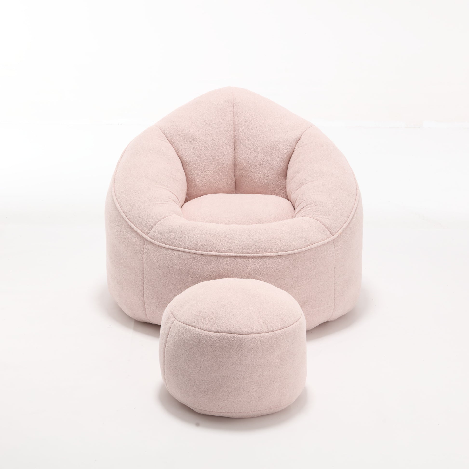 Plush pink bean bag chair with matching ottoman perfect for a childs playroom