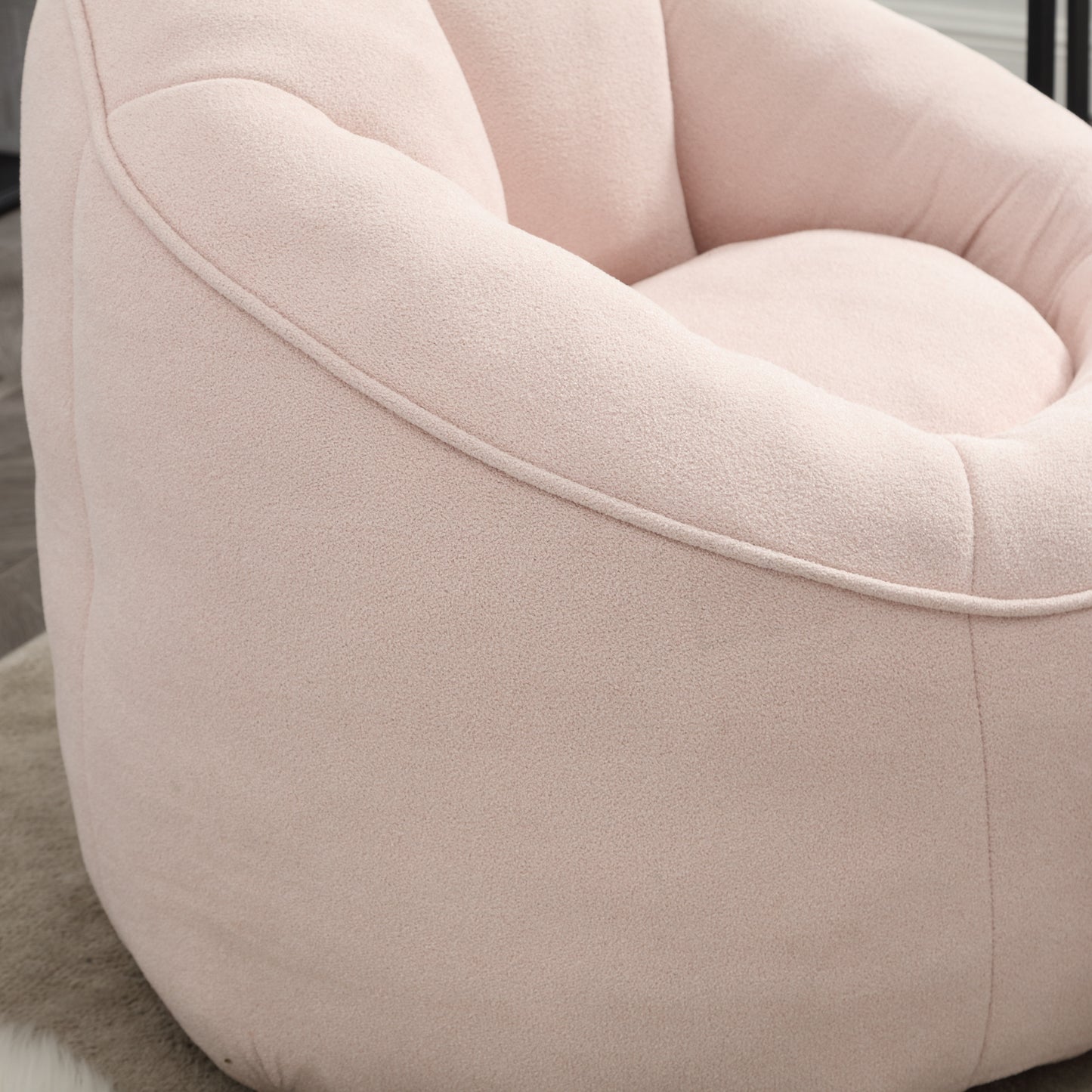 Plush pink bean bag chair with textured fabric for cozy seating