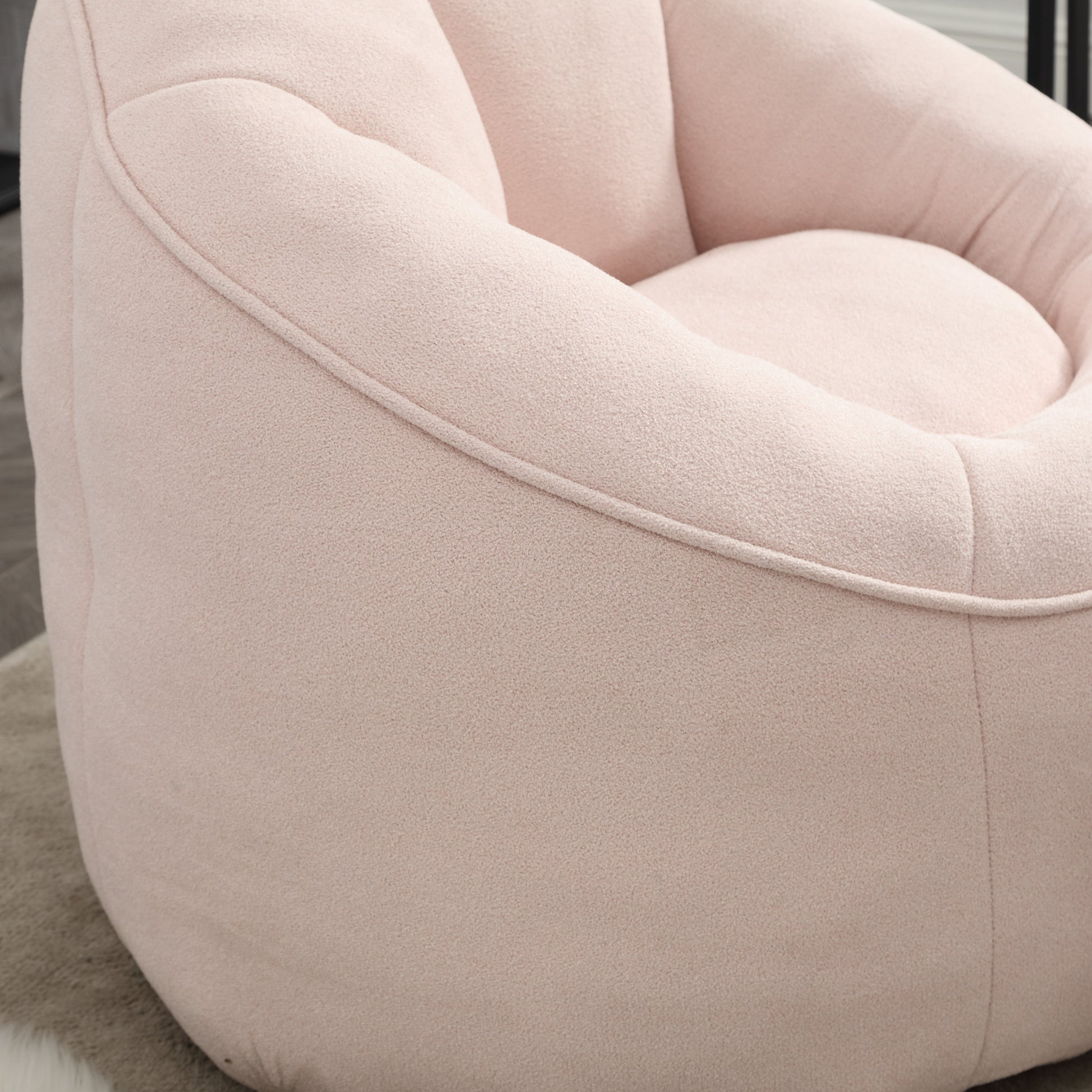 Plush pink bean bag chair with textured fabric for cozy seating