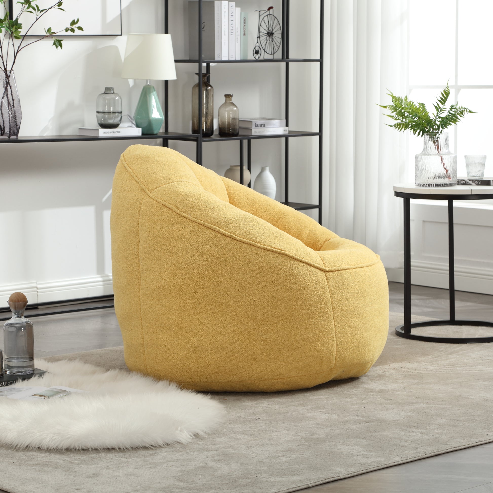 Comfortable yellow boucle bean bag chair with plush texture