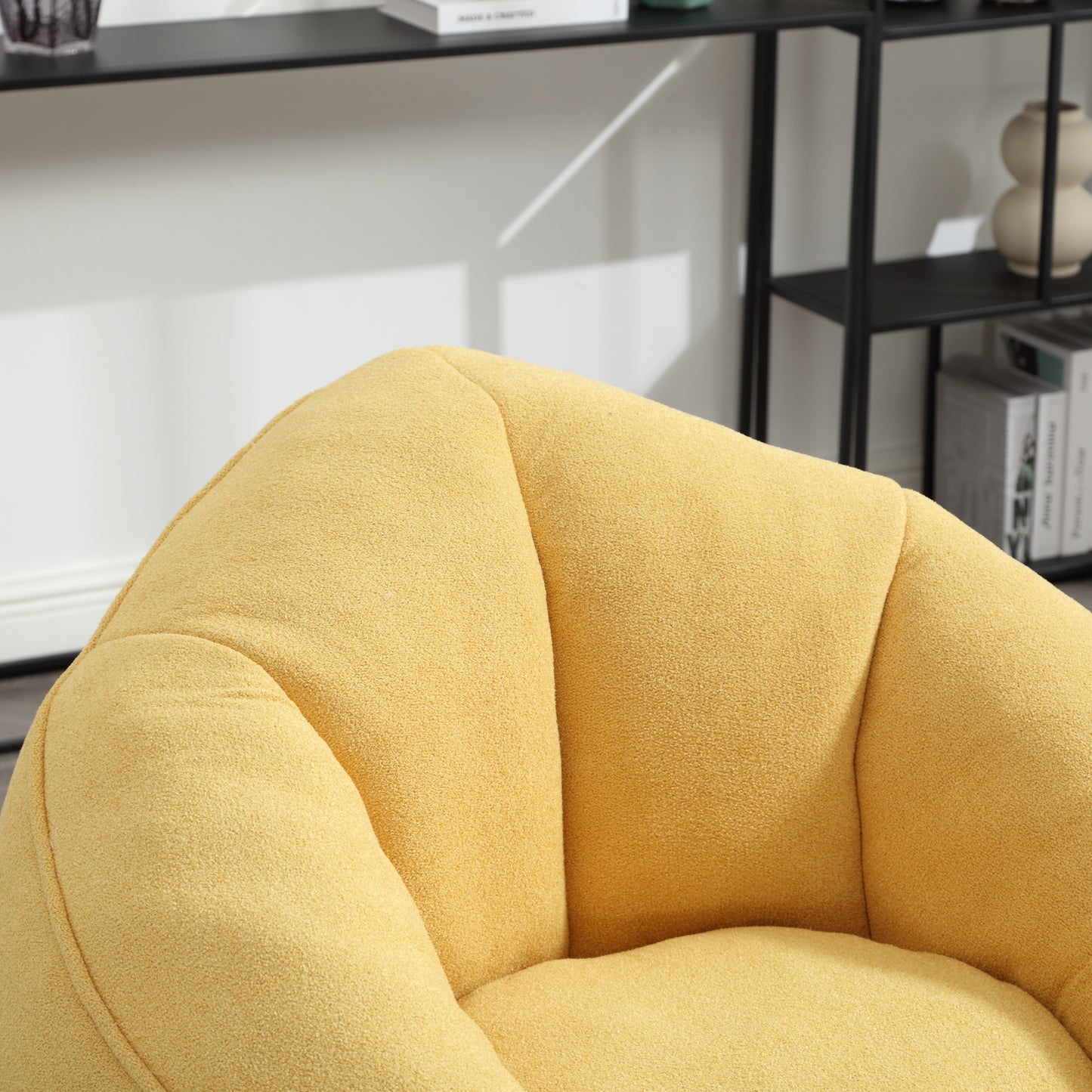 Textured yellow boucle fabric armchair plush seat detail