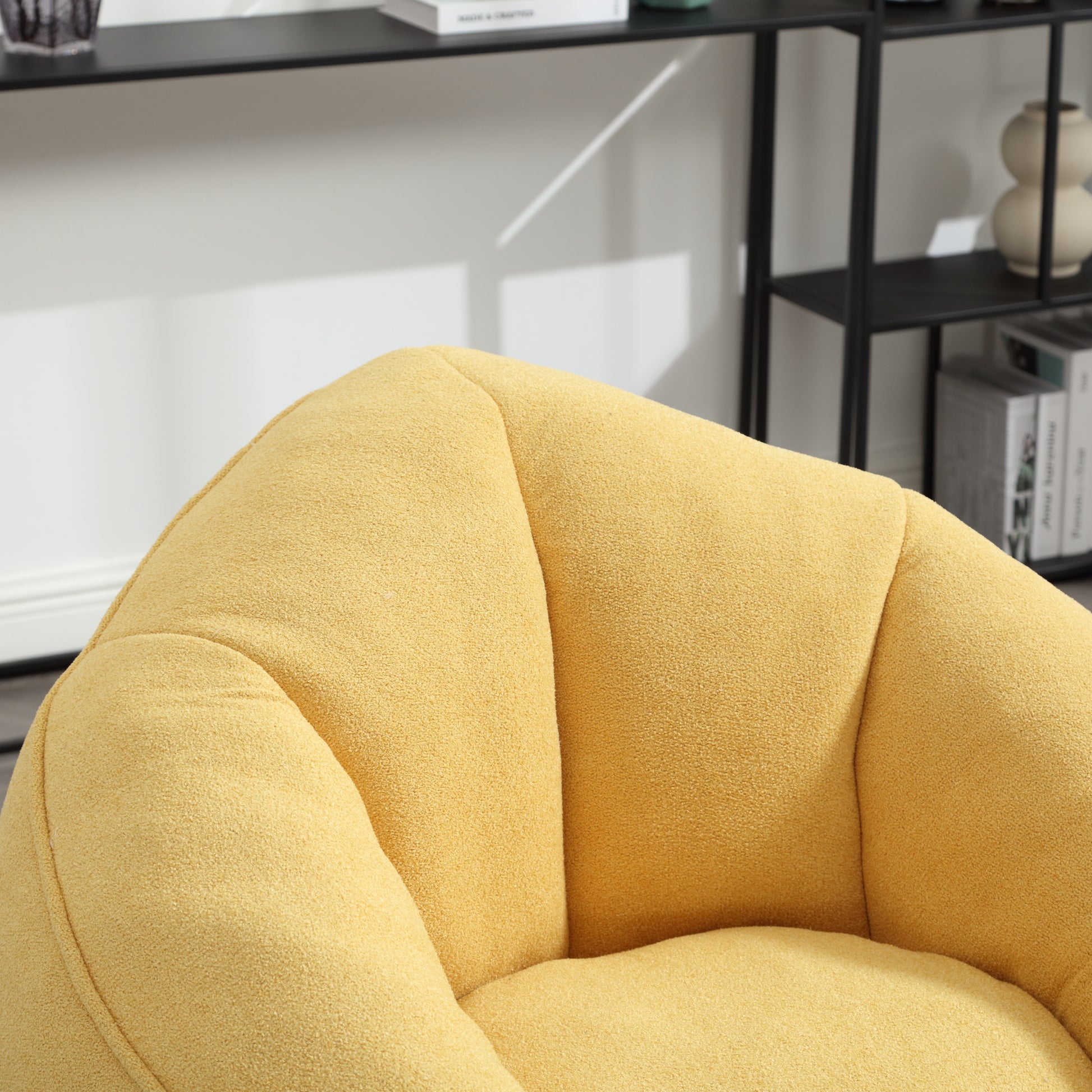 Textured yellow boucle fabric armchair plush seat detail