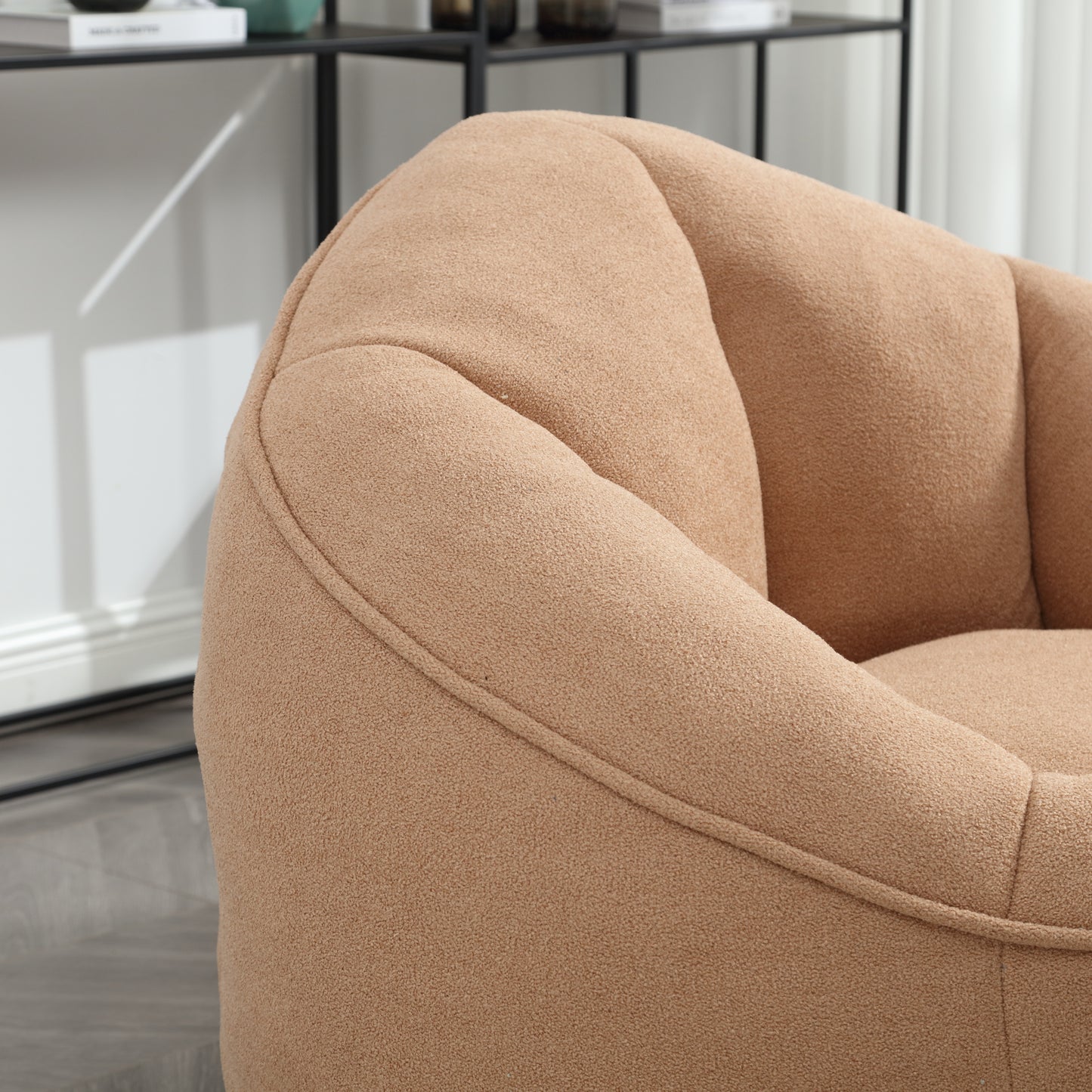 Closeup of plush beige accent chair with channel tufting and cozy texture