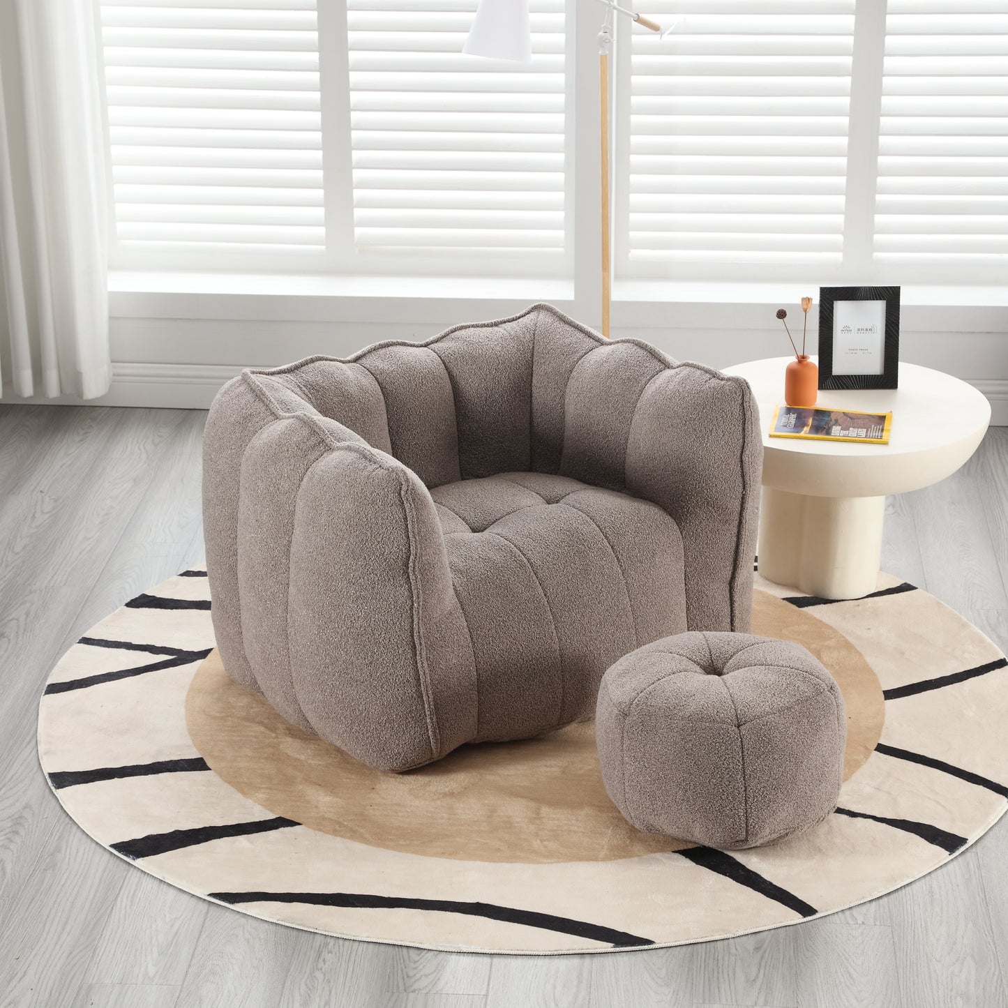 Plush boucle armchair with scalloped back and matching ottoman in taupe
