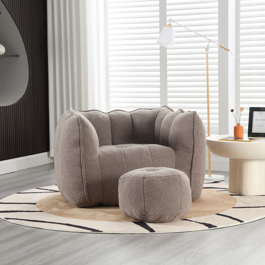 Plush taupe armchair with fluted details and matching ottoman for cozy living room seating