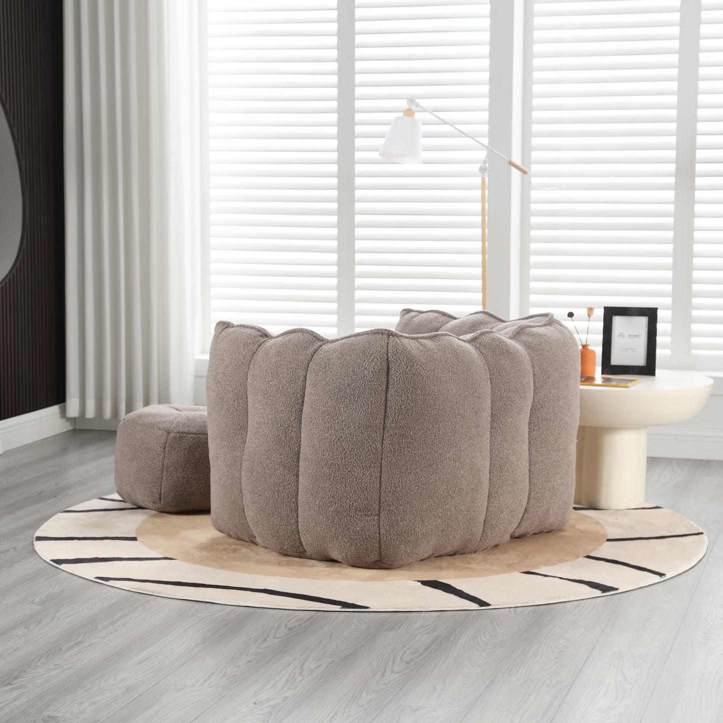 Plush taupe bean bag chair with a unique fluted design perfect for a cozy living room