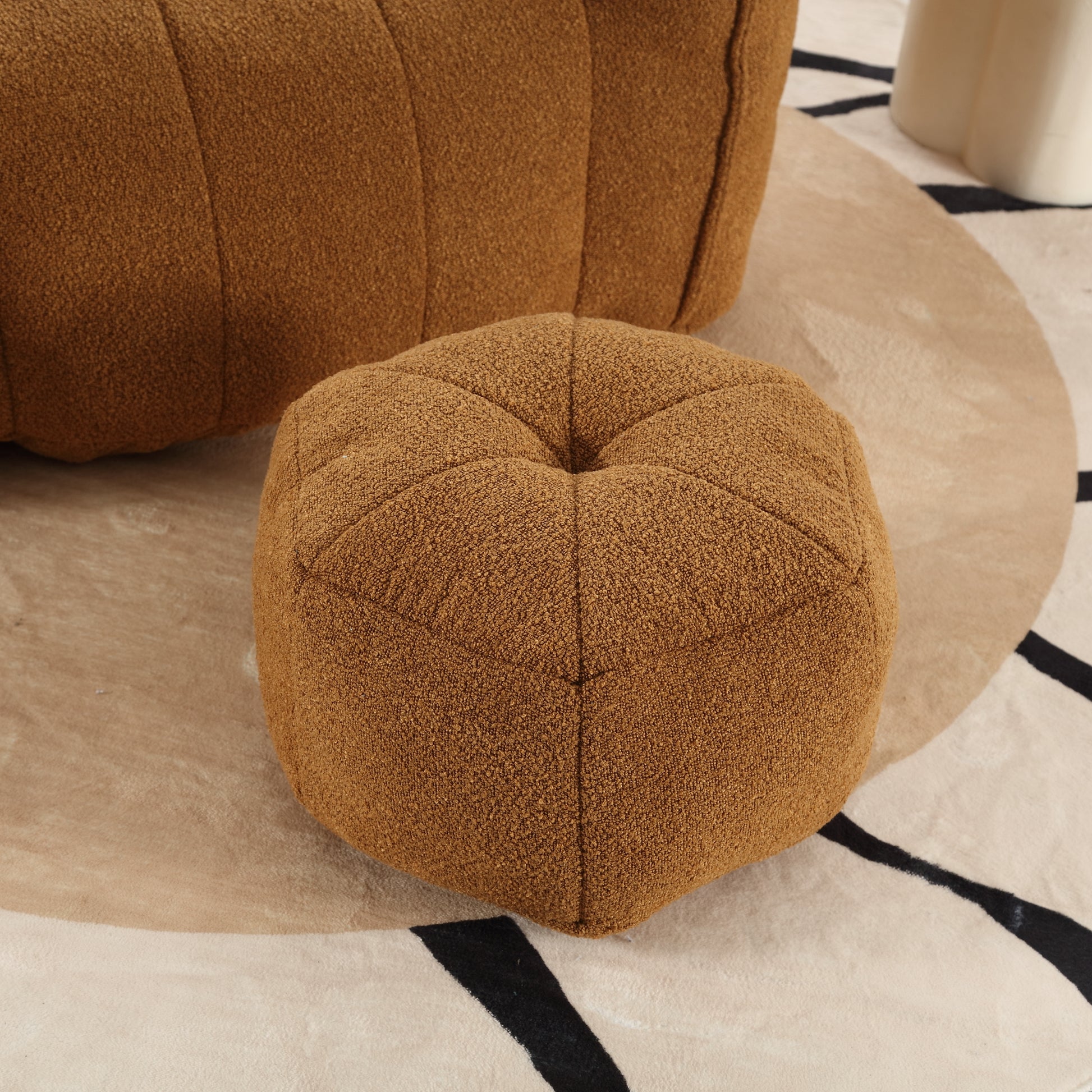 Brown textured fabric ottoman with a tufted top for sale