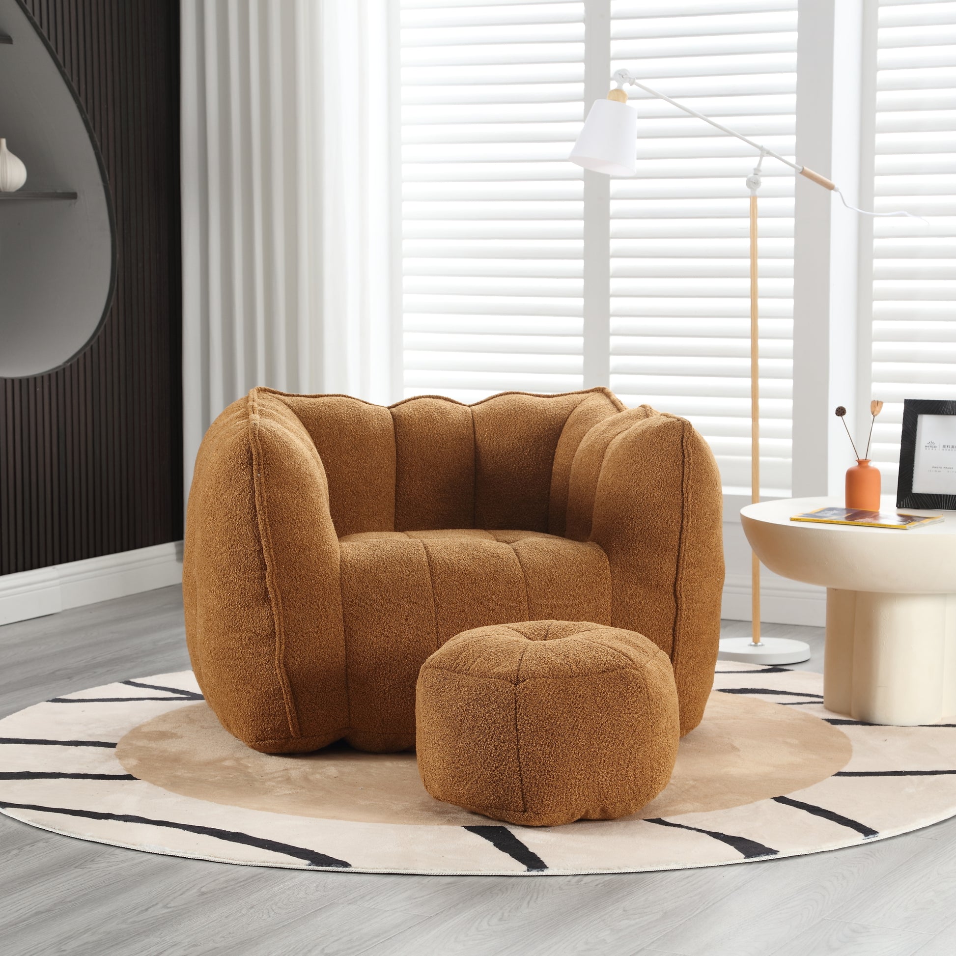 Plush brown boucl accent chair with matching ottoman perfect for cozy living spaces