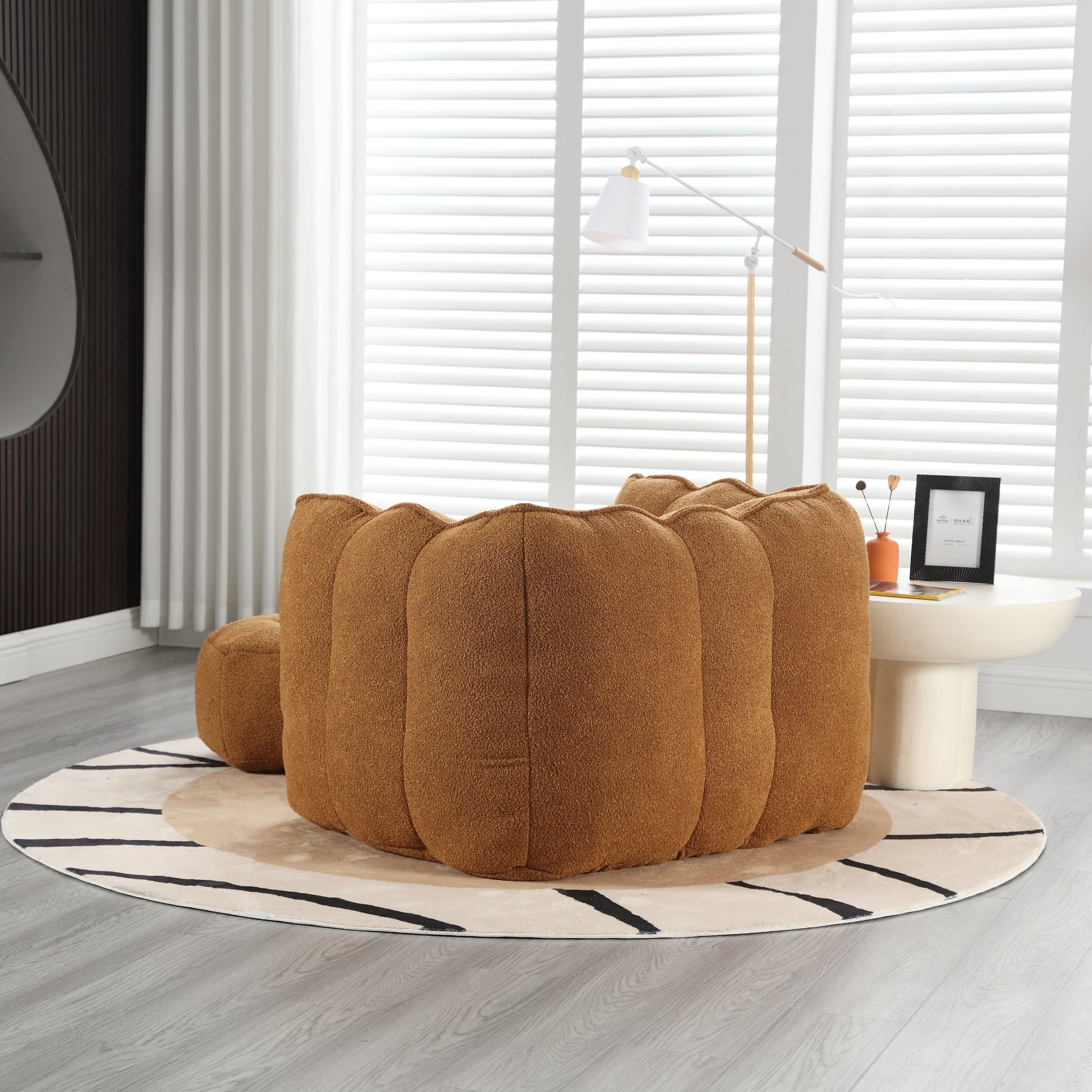 Tufted barrelshaped ottoman in warm caramel brown chenille fabric