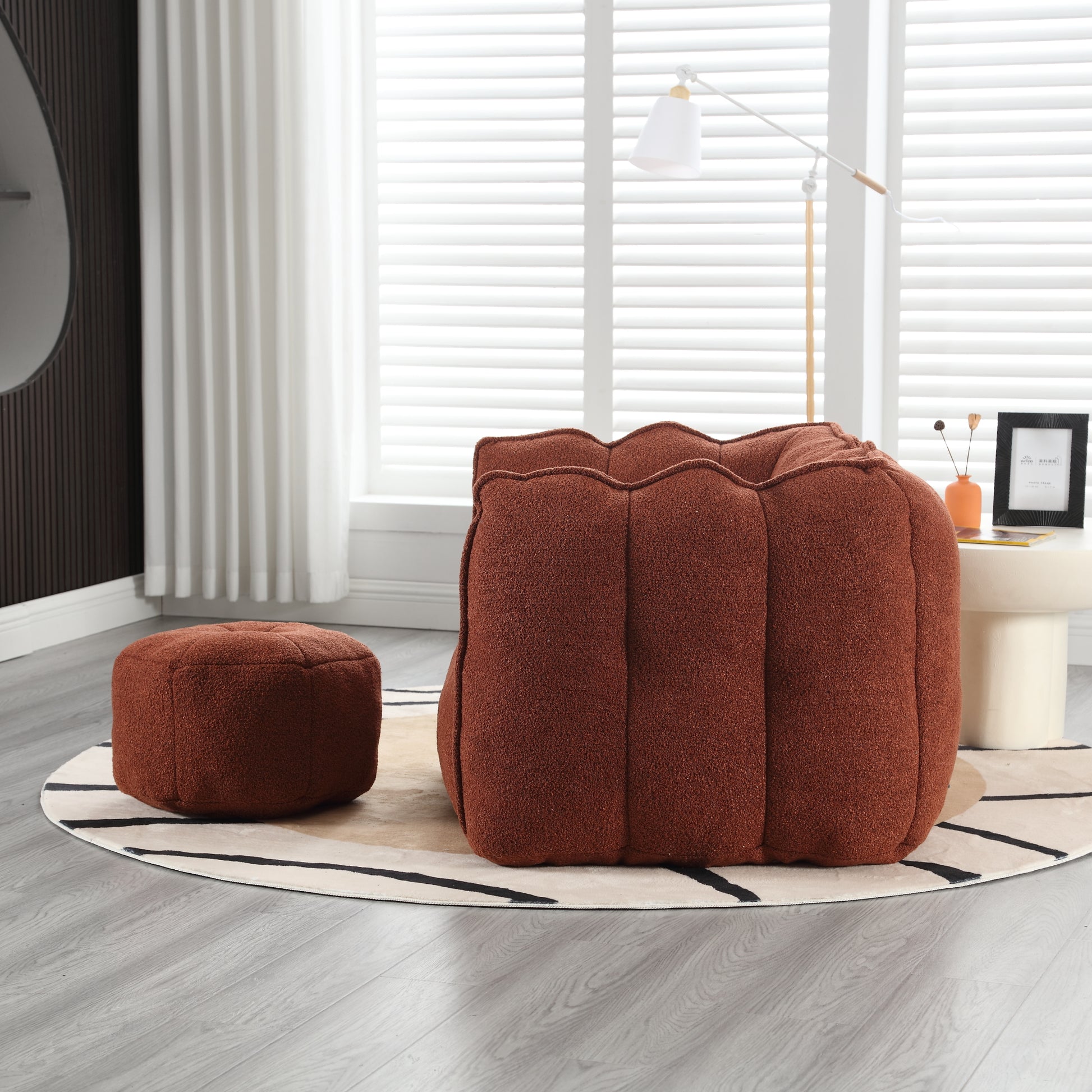Textured rust ottoman with a unique ruffled top design perfect for modern living rooms