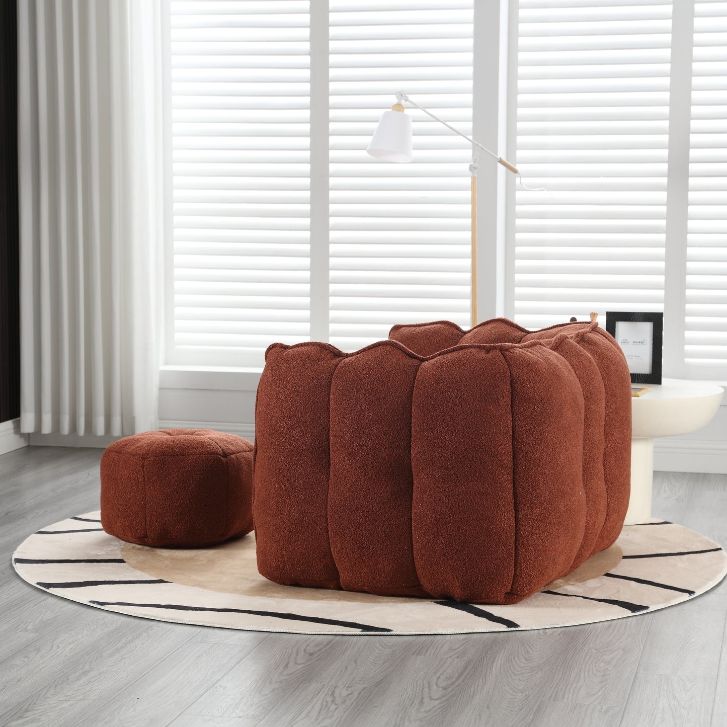 Cozy terra cotta boucl pumpkin ottoman with plush ribbed design perfect for living room decor