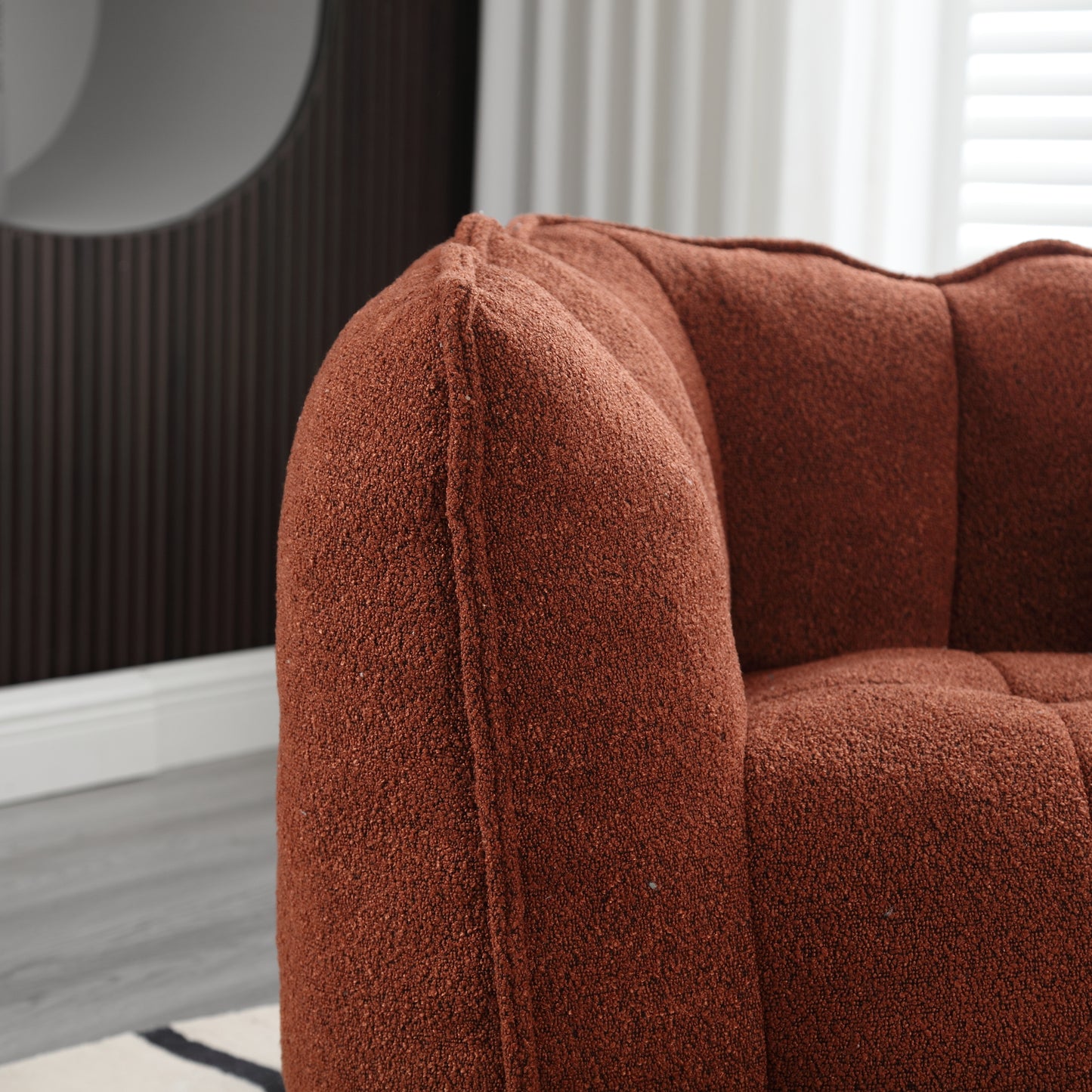 Textured terracotta boucle armchair with channel tufting detail