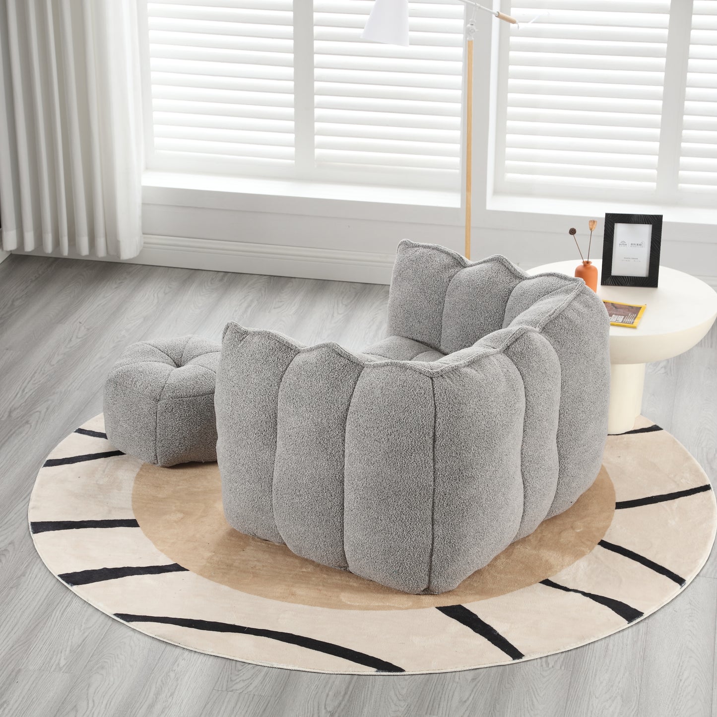 Plush grey bean bag chair with a rounded cloudlike design for a cozy living room