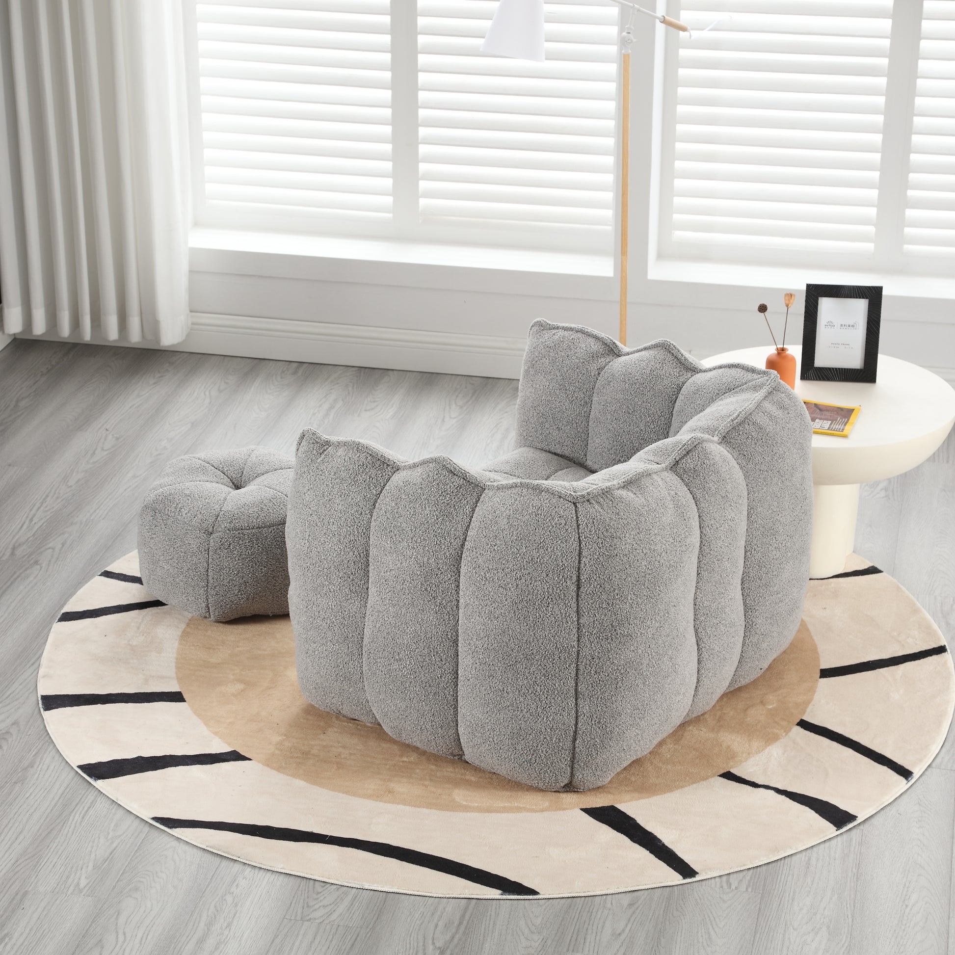Plush grey bean bag chair with a rounded cloudlike design for a cozy living room