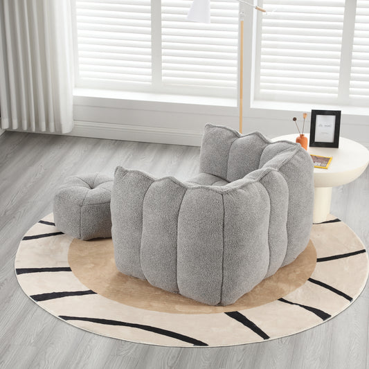 Plush grey bean bag chair with a rounded cloudlike design for a cozy living room