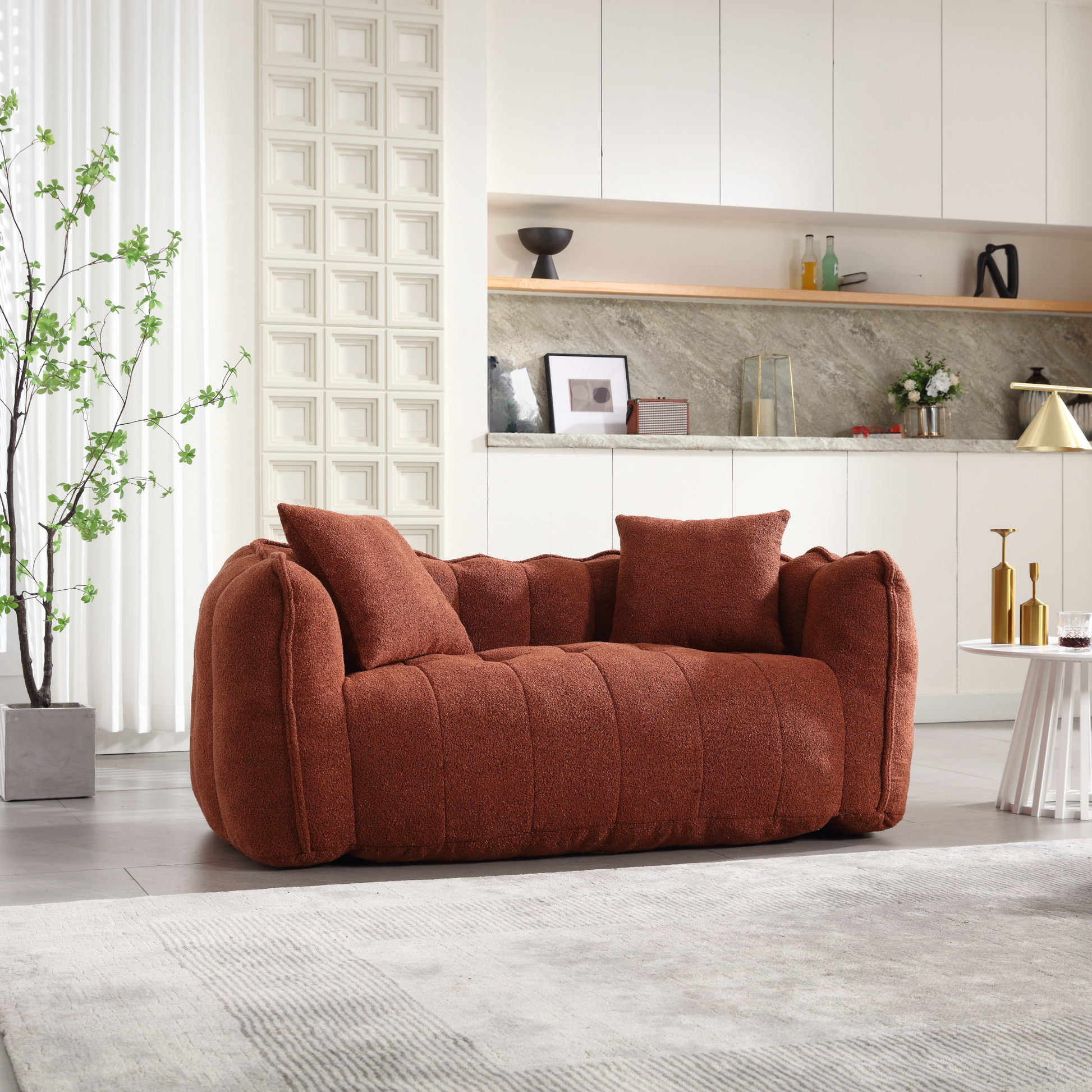 Terracotta boucle fabric loveseat with plush seat cushions and vertical tufting detail