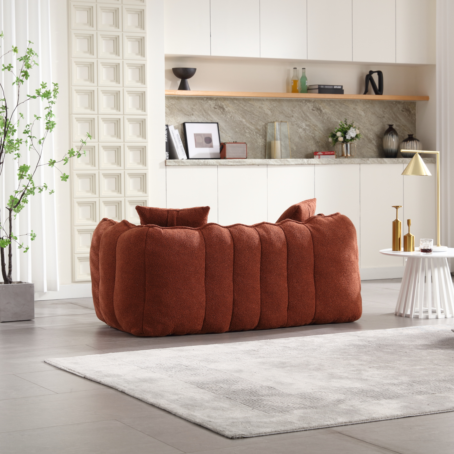 Terracotta boucle fabric modular sofa with plush cushioning and accent pillows