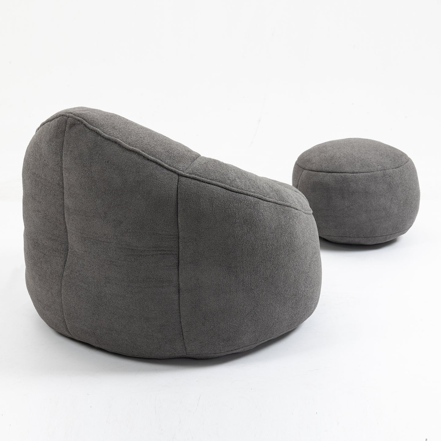 Dark grey textured fabric bean bag chair with matching footstool