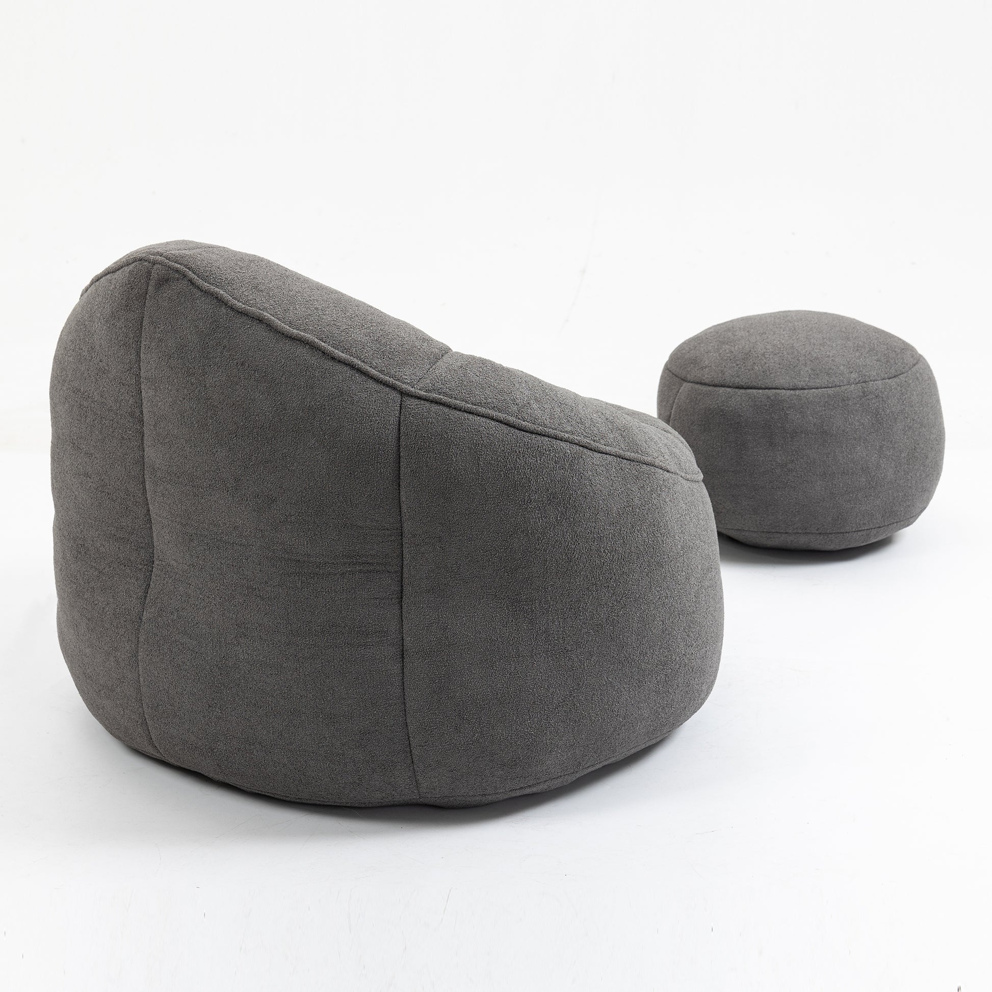 Dark grey textured fabric bean bag chair with matching footstool