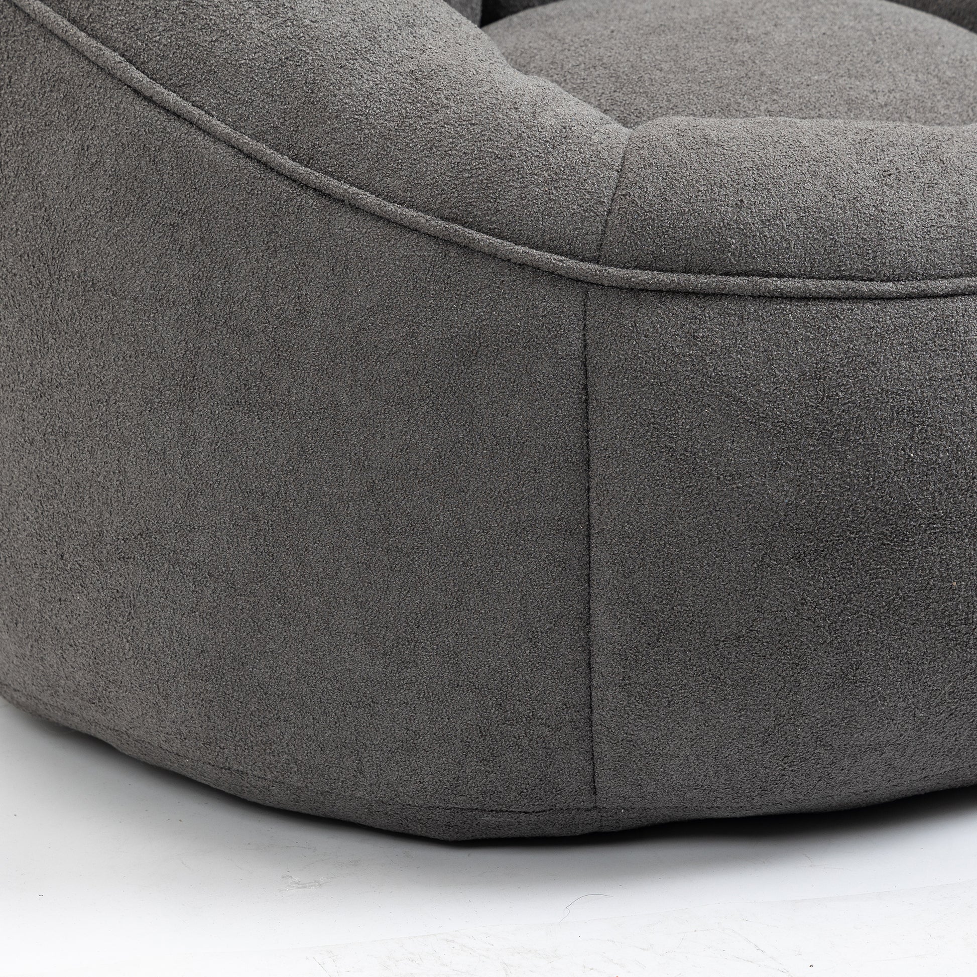 Dark grey textured bean bag chair with subtle stitching detail