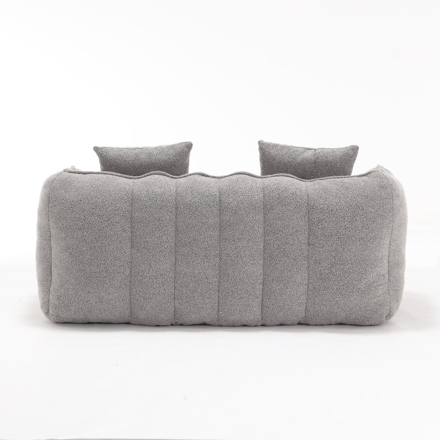 Plush grey boucle sofa with two matching lumbar pillows modern design