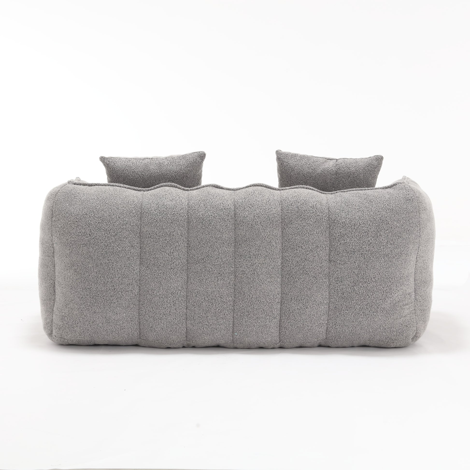 Plush grey boucle sofa with two matching lumbar pillows modern design