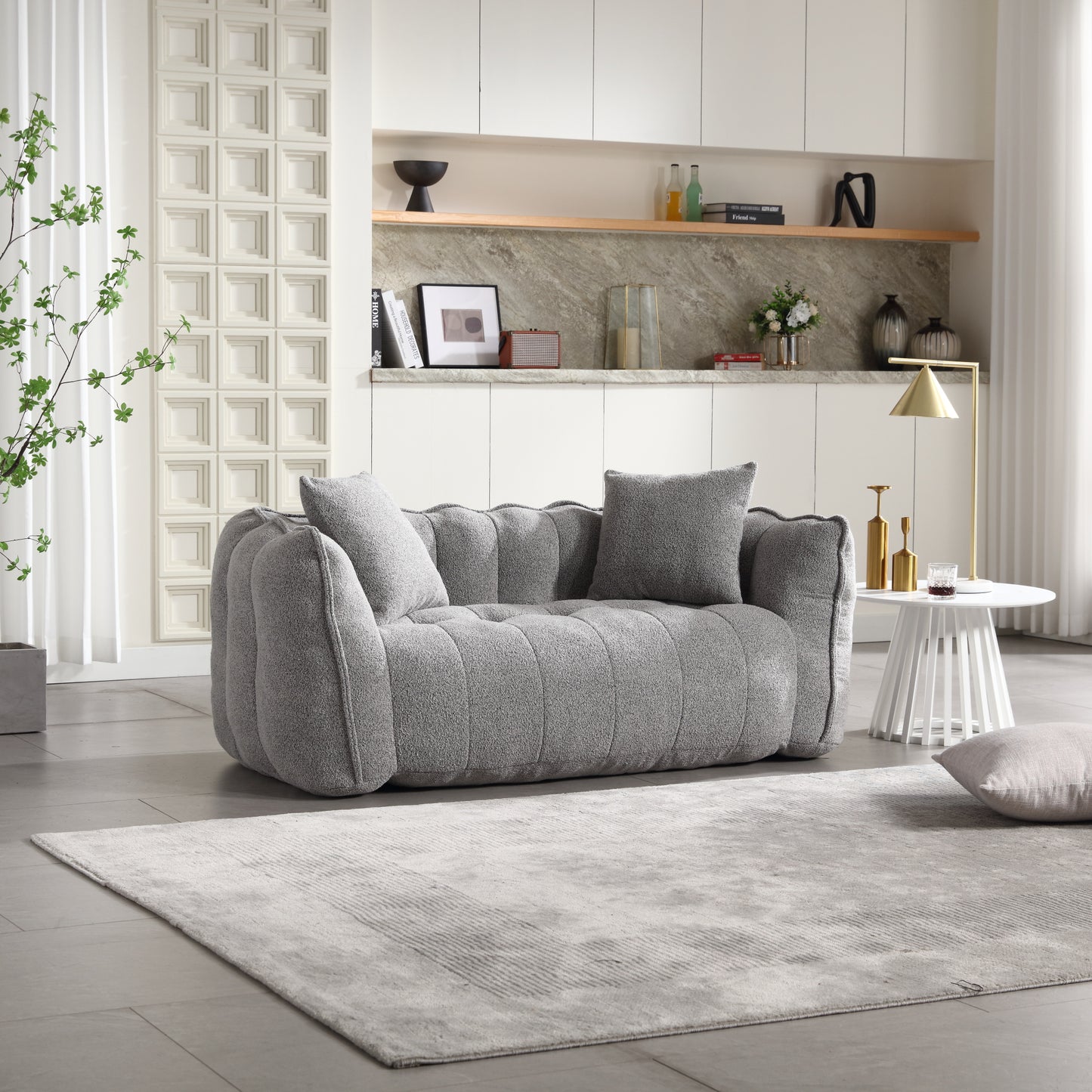 Plush grey boucle fabric loveseat with tufted seat and rounded arms accent pillows included