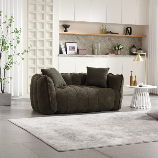 Plush olive green sofa with tufted detailing and matching accent pillows for a cozy living space