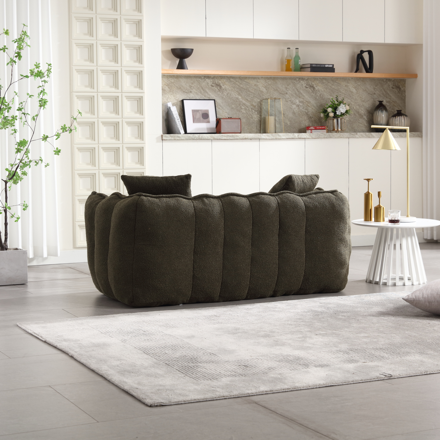 Dark green boucle tufted sofa with plush cushions perfect for a modern living room