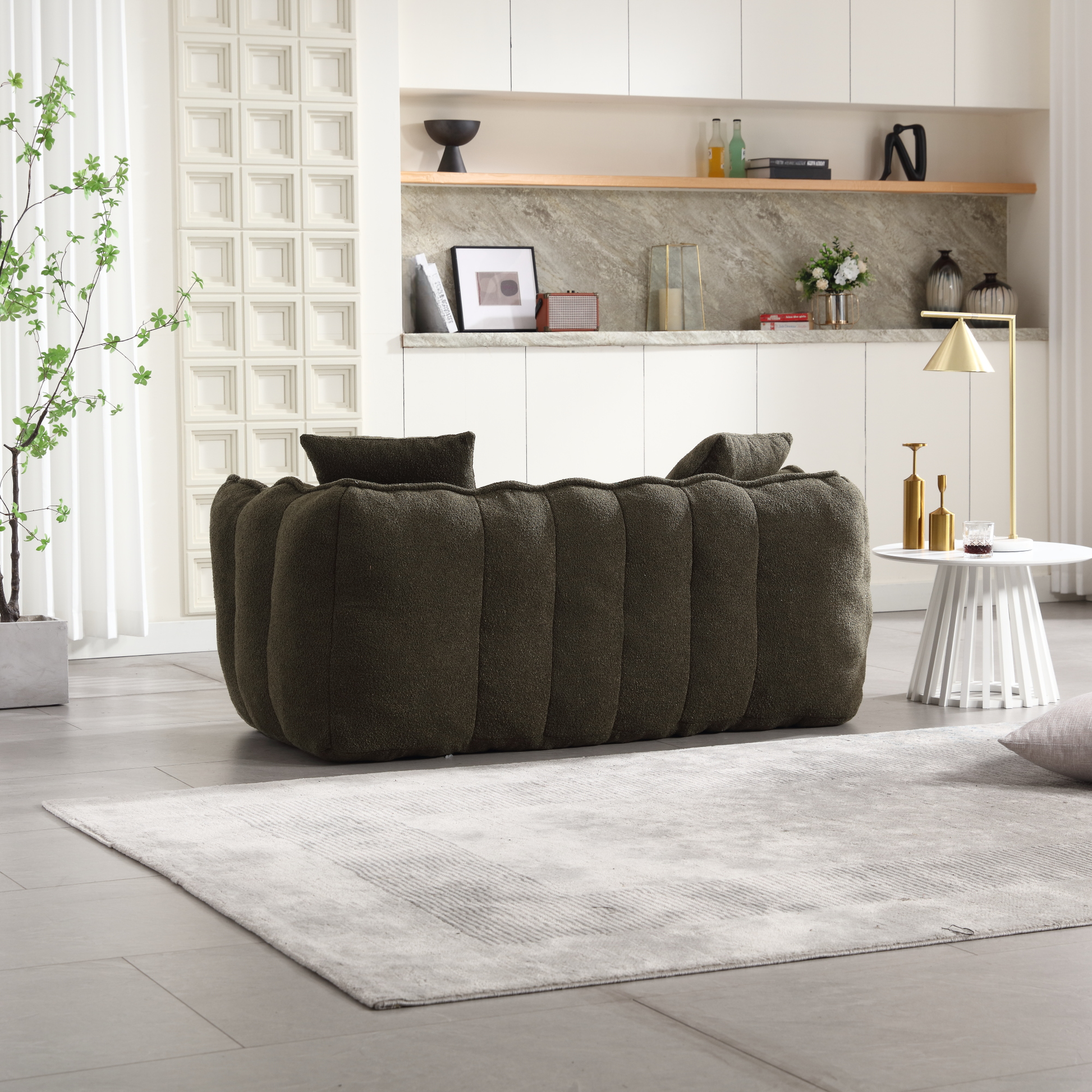 Dark green boucle tufted sofa with plush cushions perfect for a modern living room