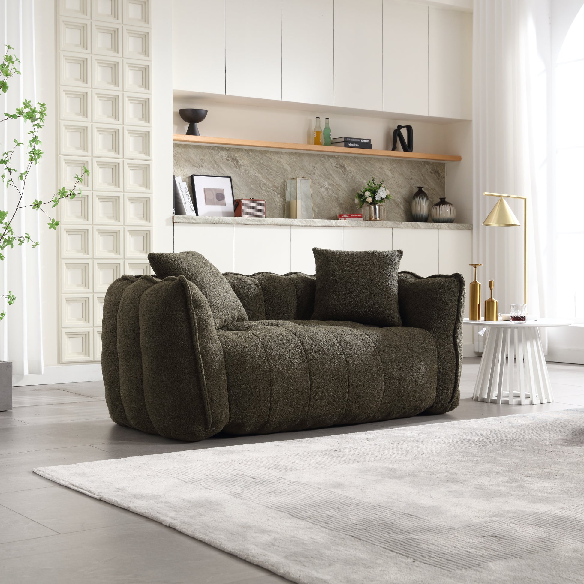 Plush olive green tufted sofa with cozy throw pillows for living room comfort