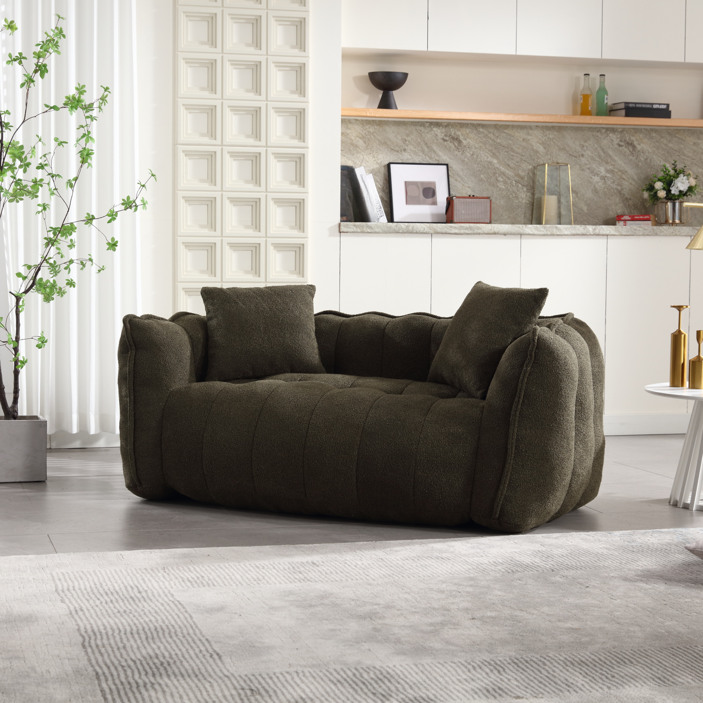Dark green textured boucle sofa with two matching throw pillows contemporary design