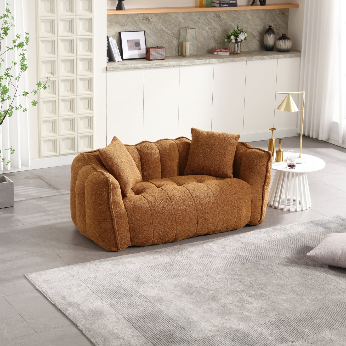 Tufted terracotta boucle sofa with plush accent pillows for cozy living rooms